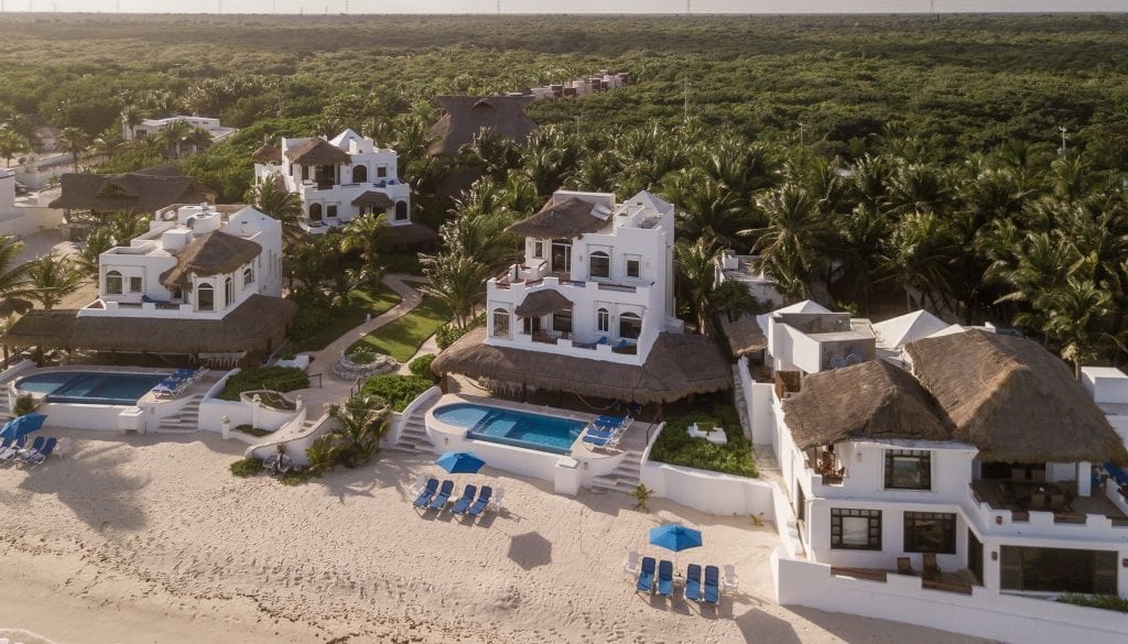 Hacienda del Secreto aerial of the estate pool and palapa roofs — Playa del Carmen, Mexico