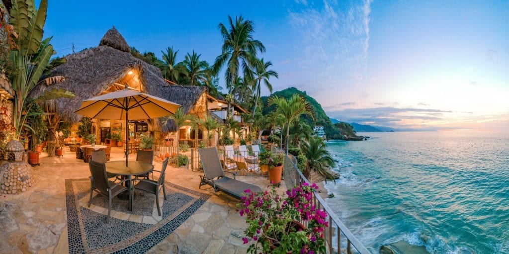 Casa Cosmos the palapa and terrace over the shoreline at sunrise — Puerto Vallarta, Mexico