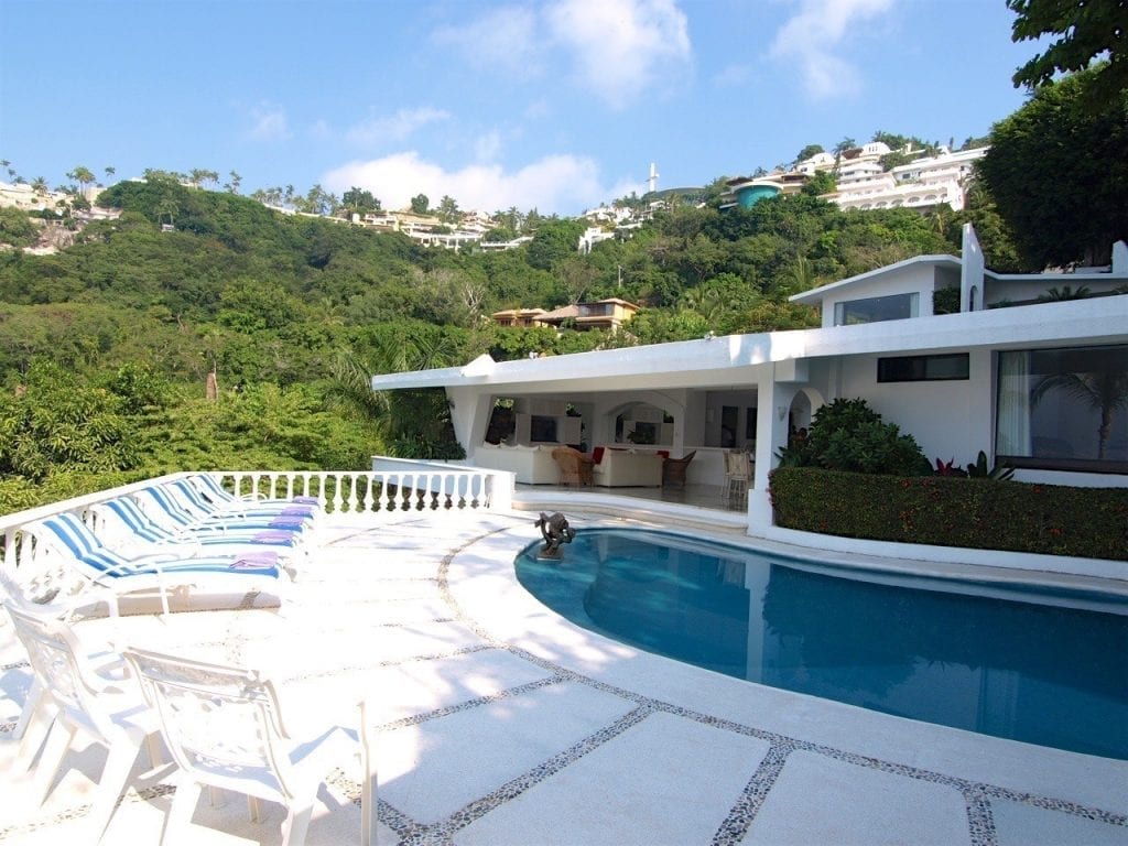 Villa Lina the white house above its pool on the hillside — Acapulco, Mexico