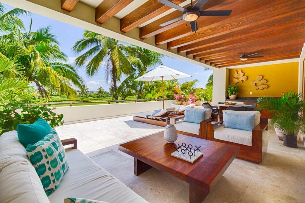 Condo Bahia the terrace lounge open to the palm canopy — Punta Mita, Mexico