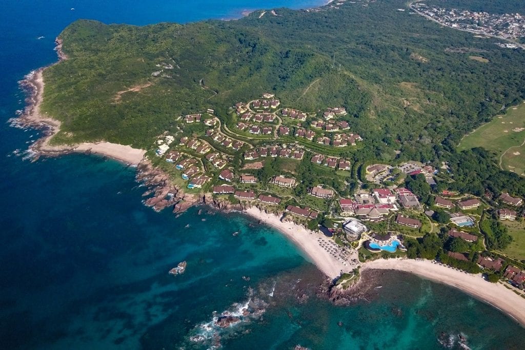 Four Seasons Twin Villas aerial view of a forested peninsula with buildings and beaches — Punta Mita Nayarit, Mexico