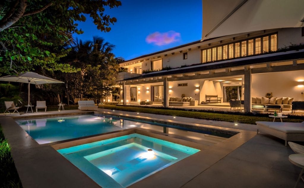 Casa Ixchel pool and spa lit blue at nightfall — Tulum, Mexico
