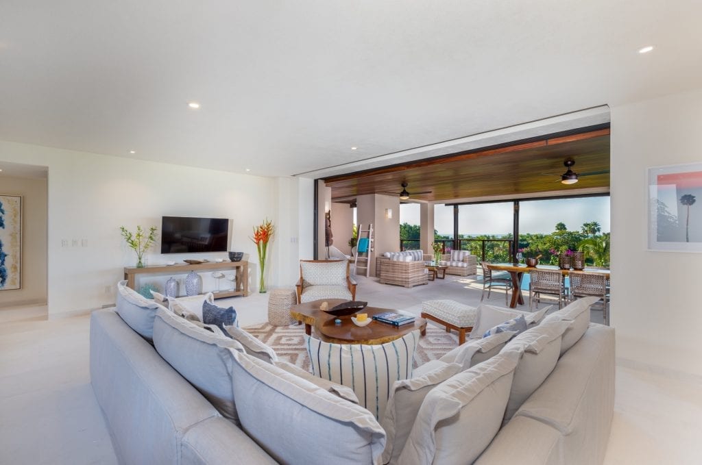Condo Las Marietas F101 living room opening to a covered patio — Punta Mita Nayarit, Mexico