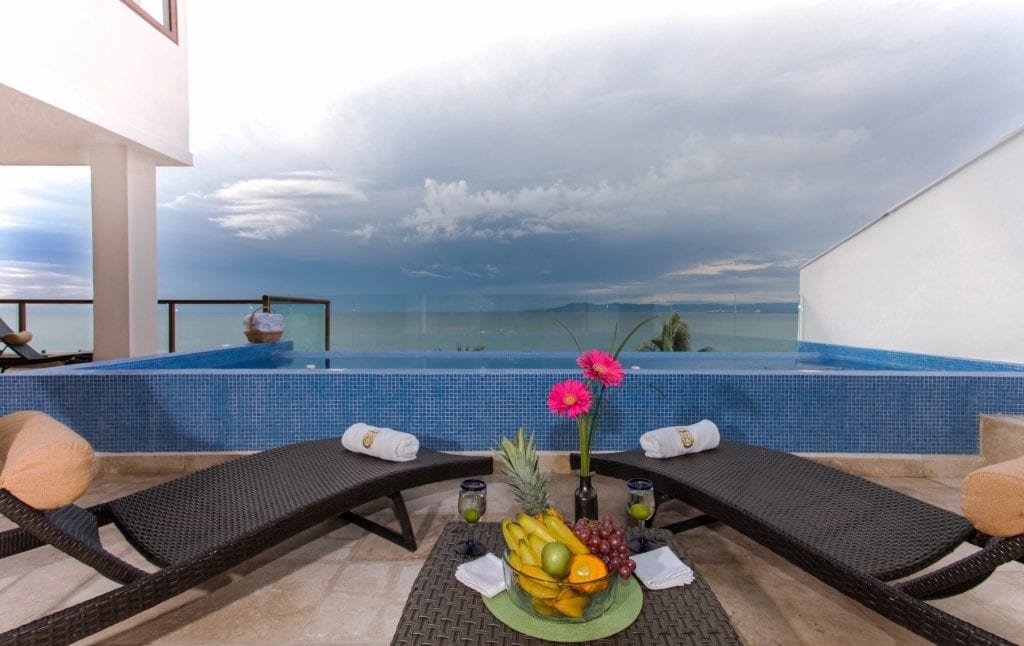 Vallarta Shores Sky Suite F plunge pool with two loungers and fruit tray — Puerto Vallarta, Mexico