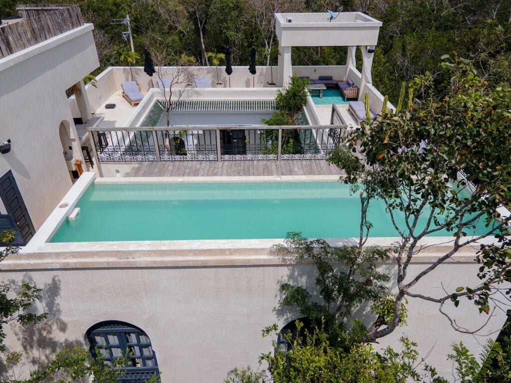 Villa Riad Ambre et Epices aerial view of the rooftop plunge pool and deck amid the jungle — Tulum, Mexico
