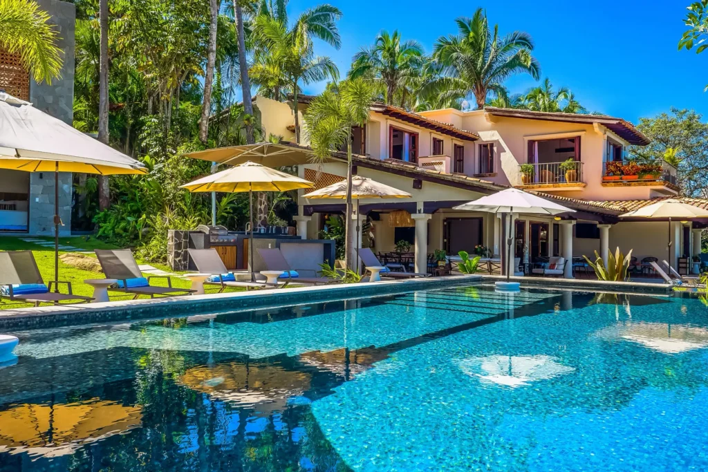 Hacienda del Mar umbrella row mirrored in the big pool — Puerto Vallarta, Mexico