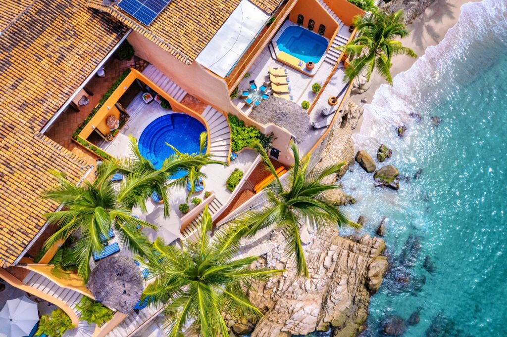 Aerial view of Villa McFuego, the beach, and the Pacific Ocean in Puerto Vallarta