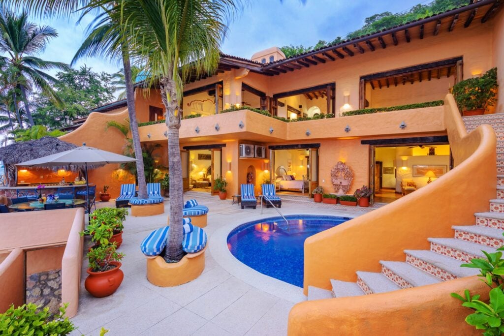 Villa McFuego the pool terrace ringed by the villa's tiers — Puerto Vallarta, Mexico