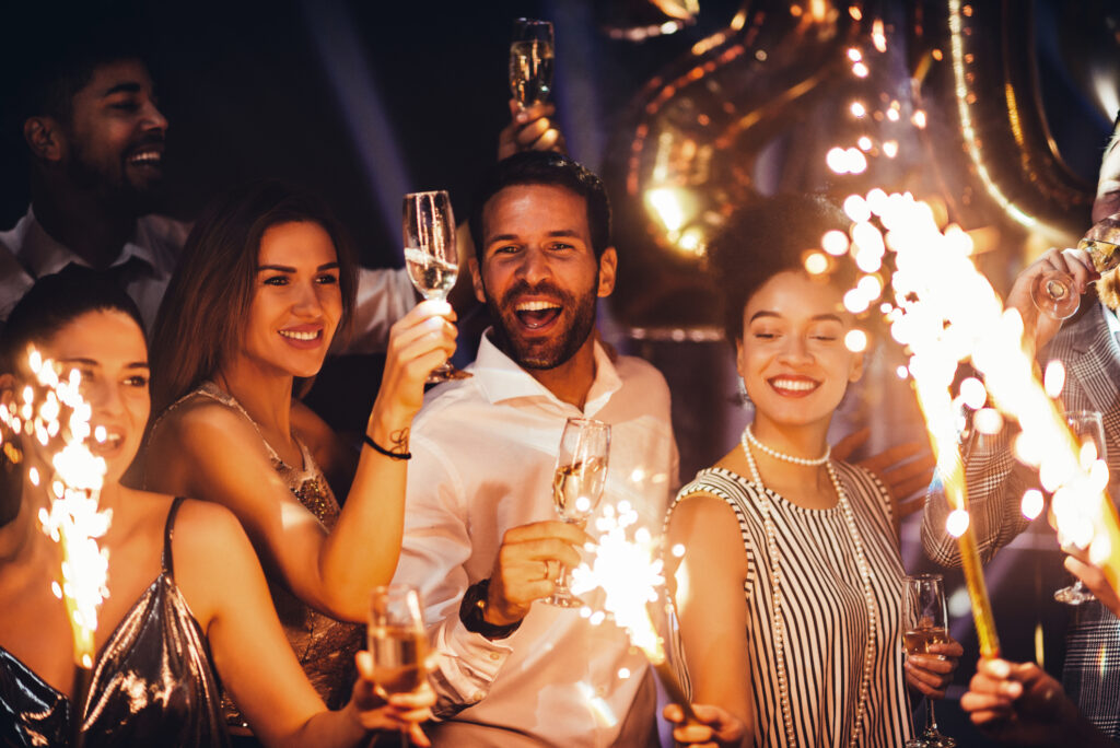 A joyful family celebrating New Year's Eve together in a spacious holiday villa in Mexico, with festive decorations and a warm atmosphere.