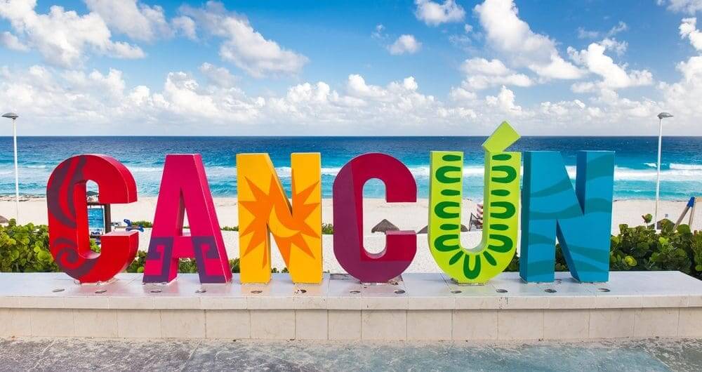 The renowned Cancun logo positioned at Playa Delfines, a signature spot in the Hotel Zone of Cancun.