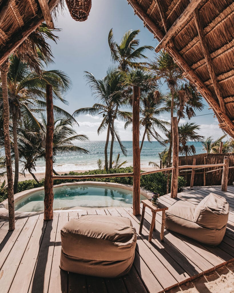 Casa Arena round plunge pool and two cushioned loungers on an ocean-view deck — Tulum, Mexico