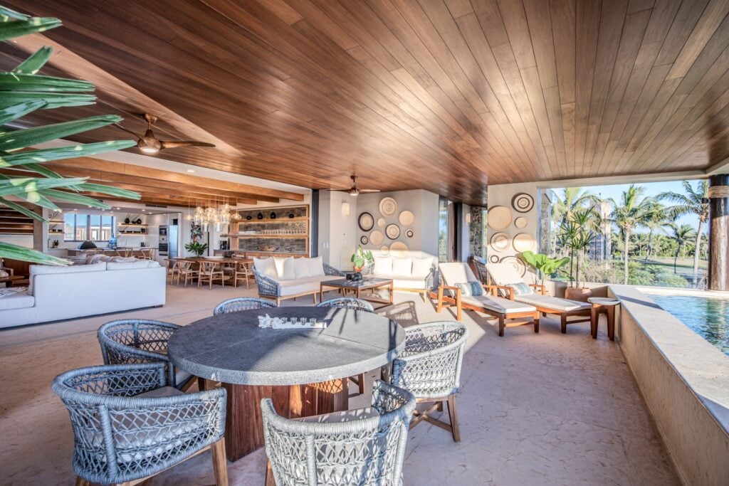 Tau Residence 412 covered terrace with round dining, lounge seating and the pool — Punta Mita Nayarit, Mexico