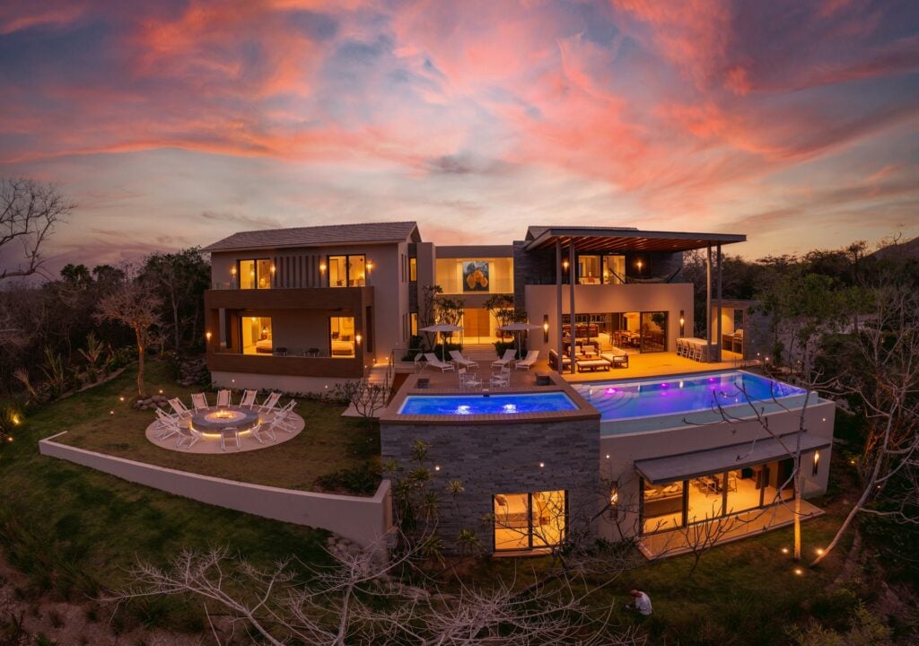 Casa Alba aerial view at sunset with the lit pool and circular fire pit — Punta Mita Nayarit, Mexico
