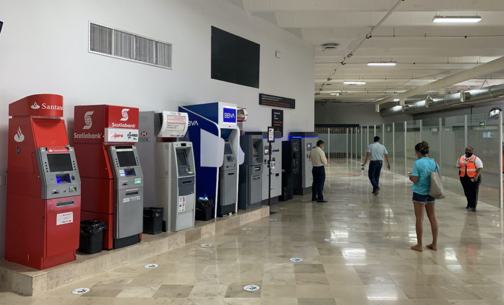 A line of ATMs from major Mexican banks located at an airport in Mexico.
