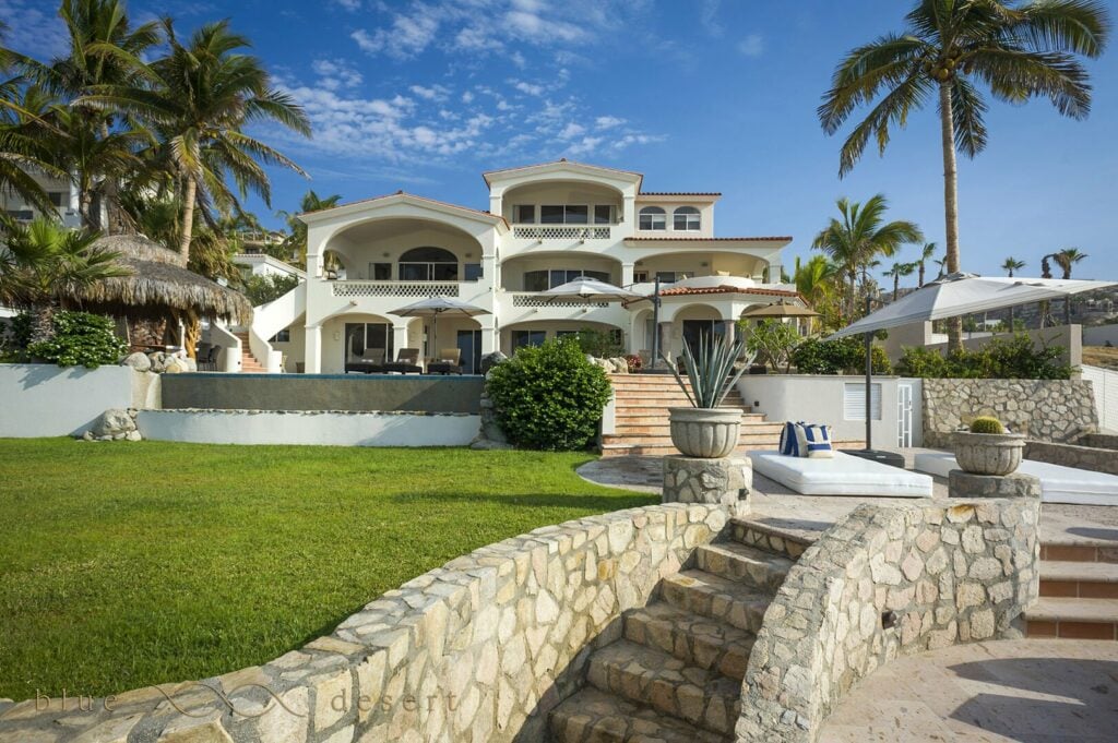 Casa Edwards Too villa exterior beyond stone steps and a green lawn — Los Cabos, Mexico