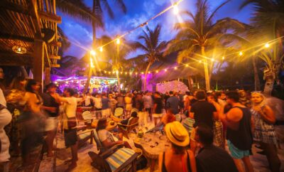 Audience enjoying a nighttime music festival in Tulum, Mexico