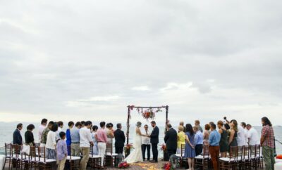 Beautiful wedding ceremony taking place at Hacienda Palo Maria with the stunning ocean view in the background.