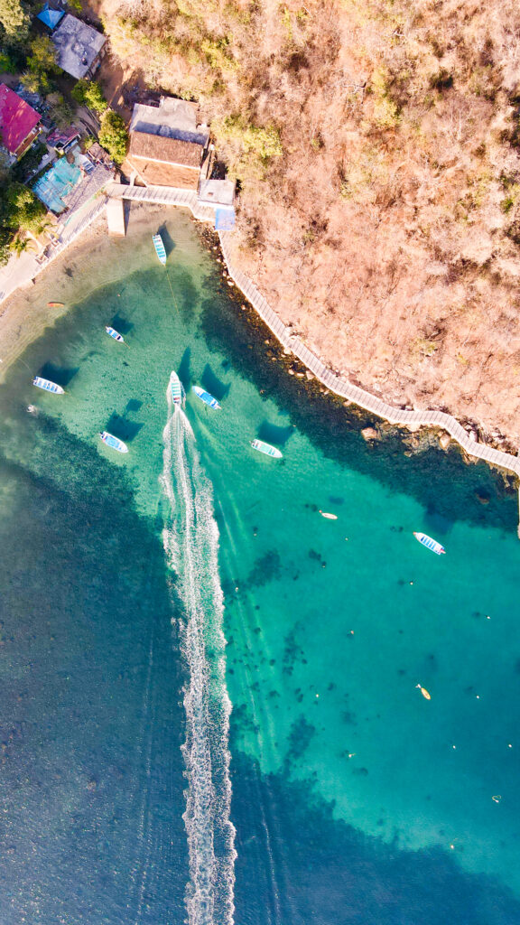 Aerial view of the beach and boat dock in Quimixto, Mexico.