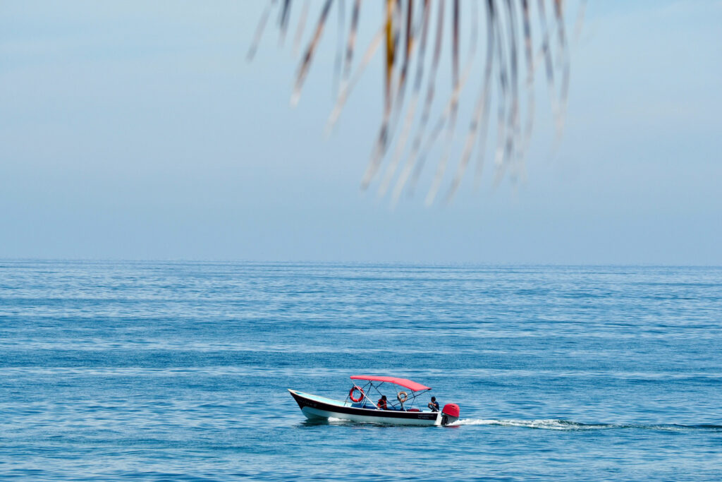 Panga boat on the ocean transferring people to Quimixto from Boca de Tomatlan or Puerto Vallarta.