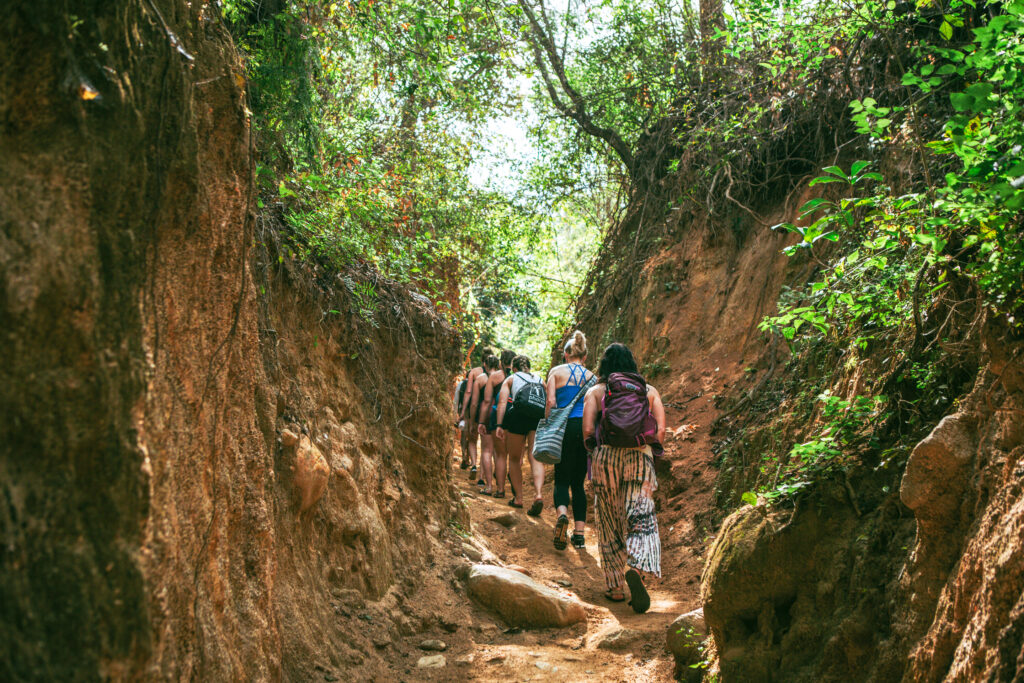 Tourists enjoying a hiking adventure in Quimixto.