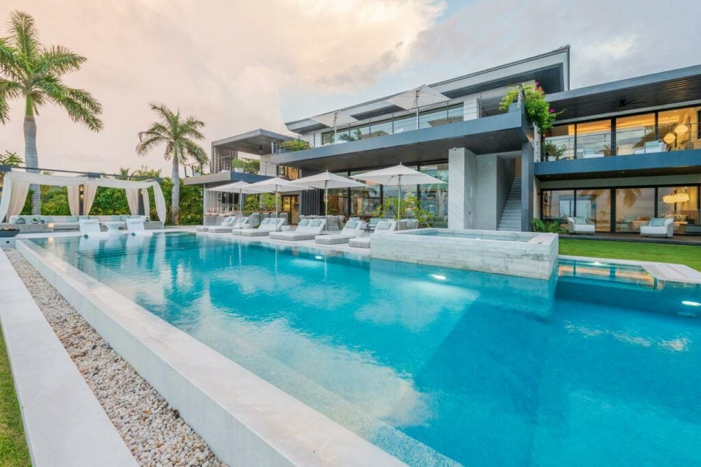 Casa Cola de Ballena pool and umbrella-shaded loungers beside the villa — Punta Mita Nayarit, Mexico