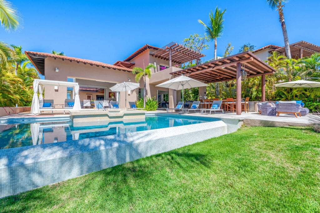 Villa Diamante lawn facing the pool and villa terraces — Punta Mita Nayarit, Mexico