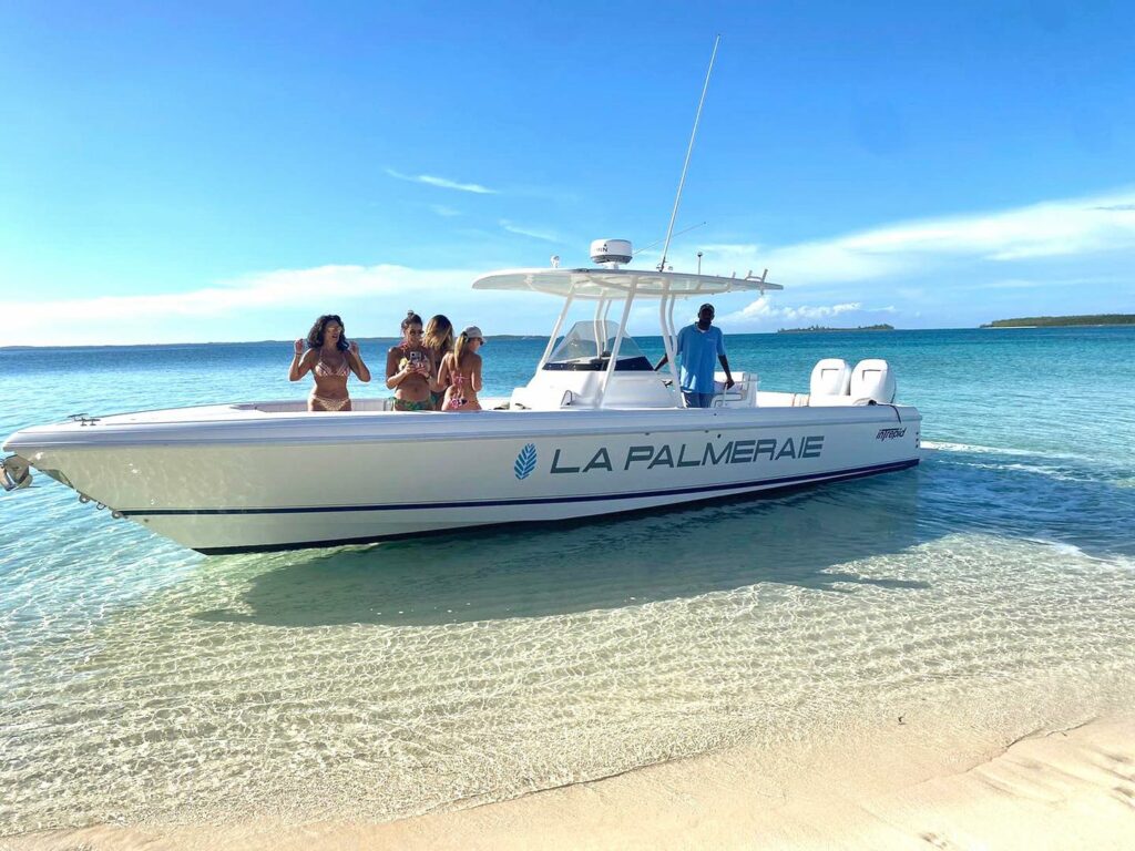 32 feet power boat available for charter at Harbour Island villas, accommodating up to 12 people.