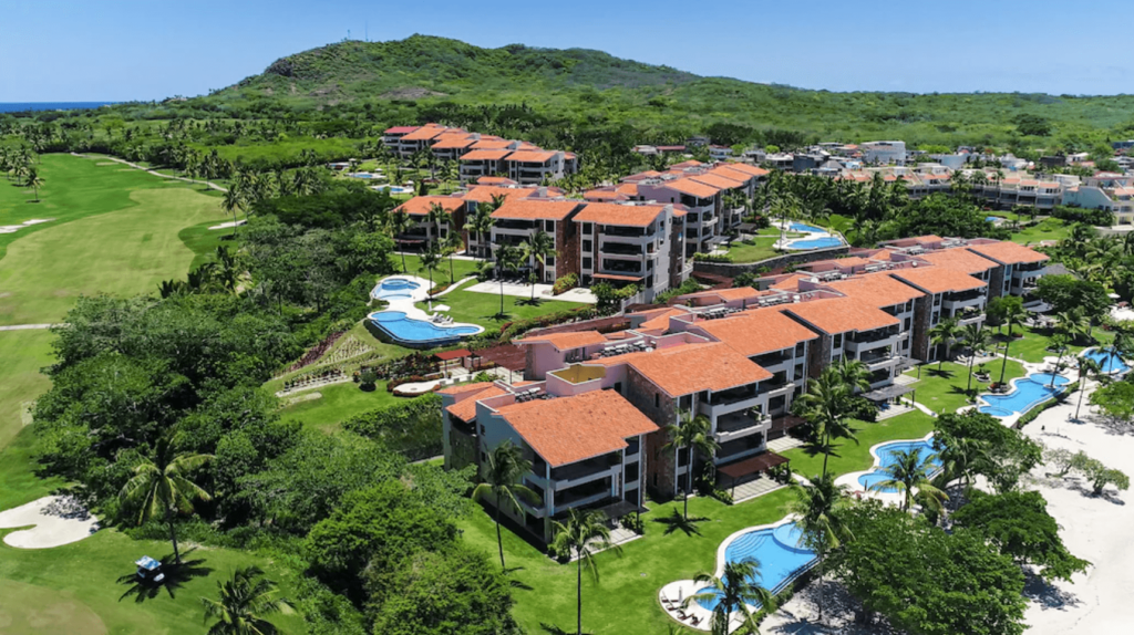 Condo Azalea aerial view of tile-roofed buildings, pools and landscaped grounds — Punta Mita Nayarit, Mexico