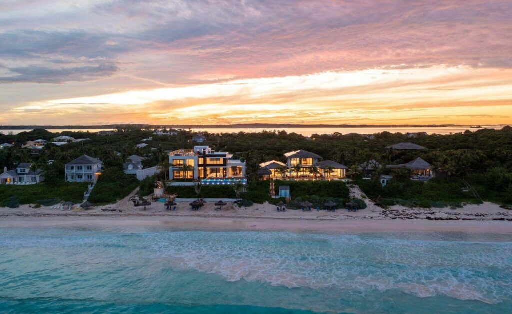 Aerial view of Harbour Island Bahamas Villa Rentals, showcasing the pristine beach and the vast Caribbean Sea.