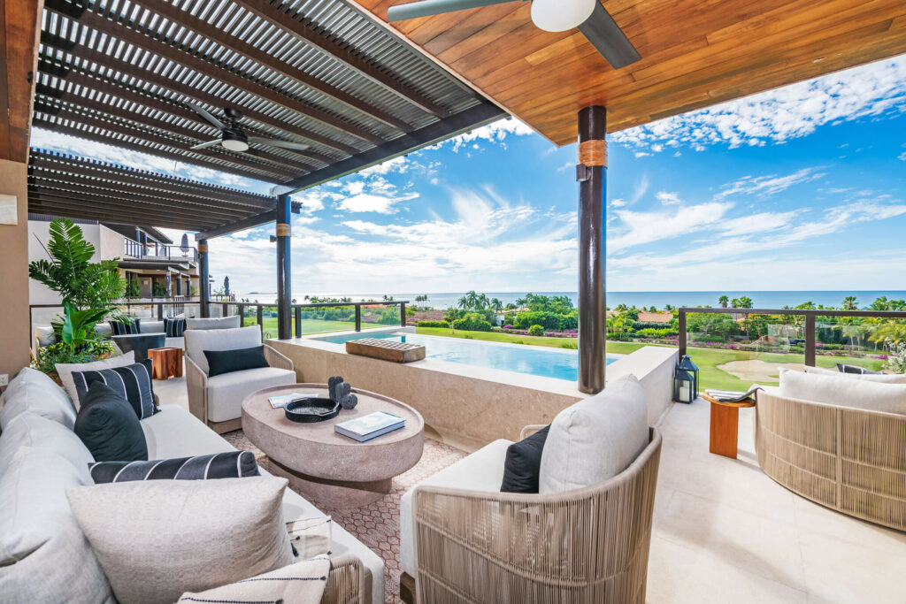 Spacious terrace at Las Marietas Condo showcasing golf course views and a private plunge pool