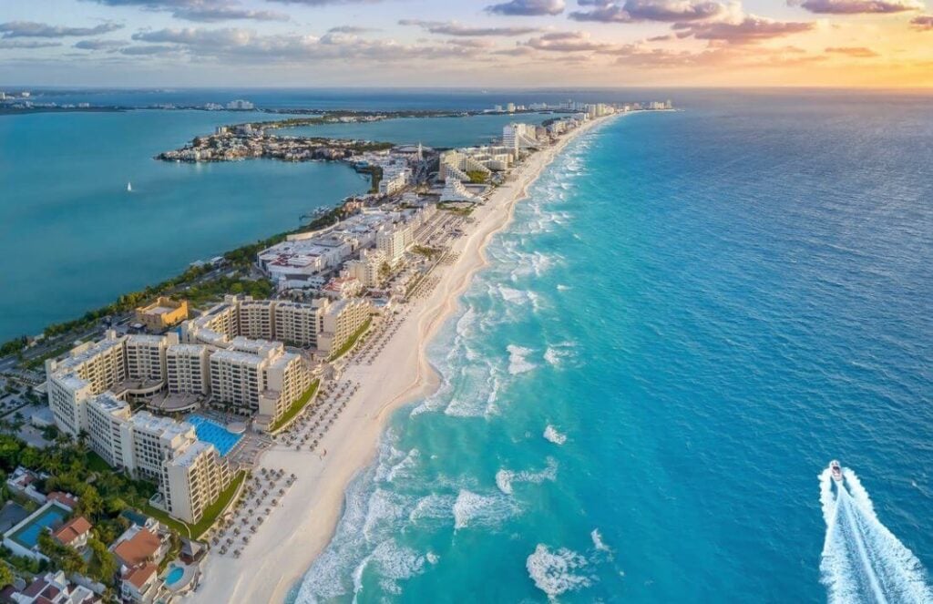 Aerial view of the bustling modern hotel zone in Punta Nizuk, Cancún.