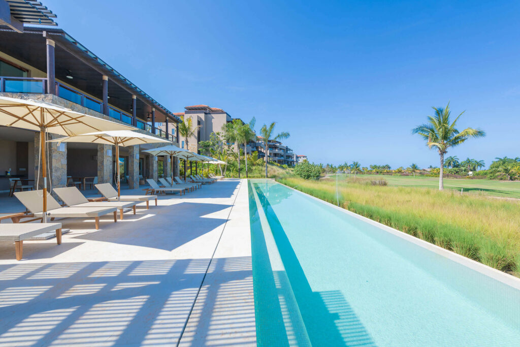 Clubhouse with pool and golf course view at Las Marietas Condo in Punta Mita