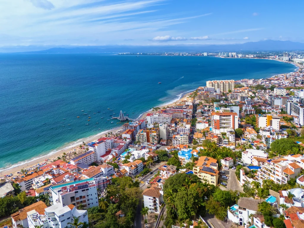 Aerial shot of Banderas Bay in Puerto Vallarta, showcasing the coastline and ocean.