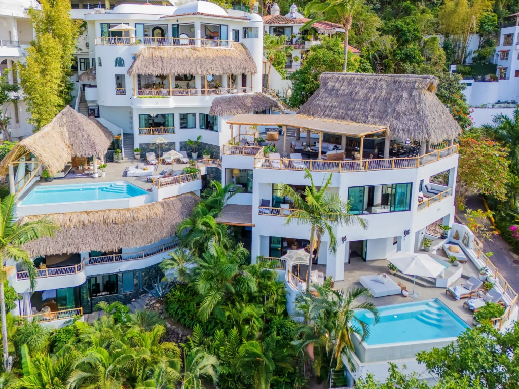 Las Villas aerial view of the multi-level hillside villa among greenery — Puerto Vallarta, Mexico