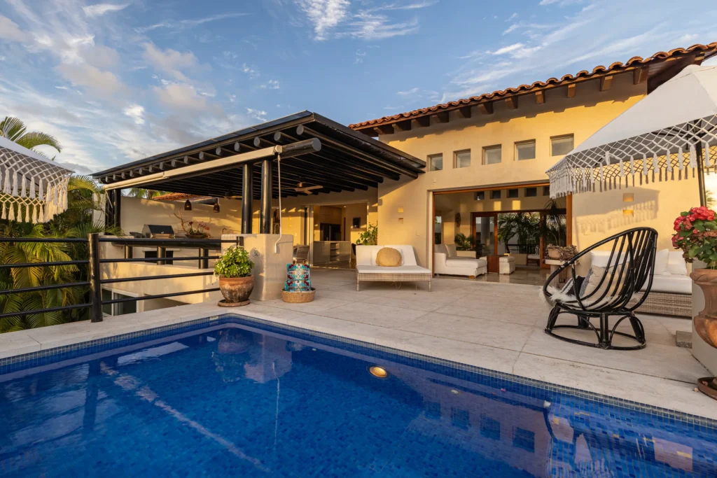 Casa Libre pool in daylight with the villa facade and covered terrace behind — Punta Mita Nayarit, Mexico