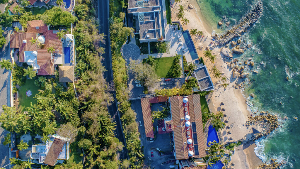 Aerial view of the residential community at Sierra del Mar with villas and beach access.