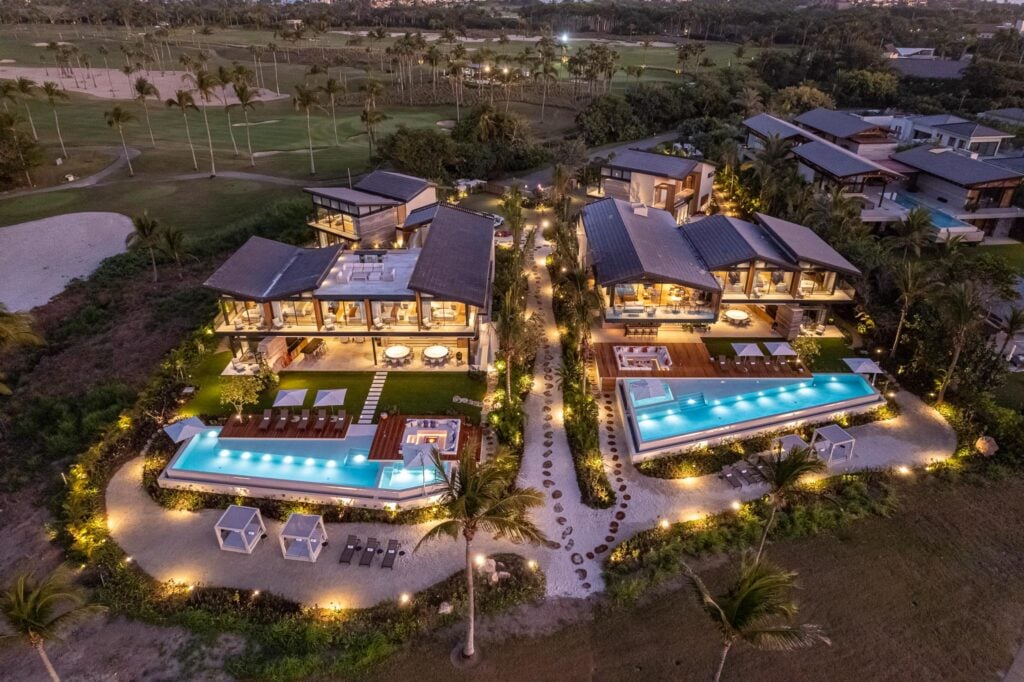 Villa Punta Pacifico Estate aerial dusk of the estate with lit pools and golf fairways — Punta Mita Nayarit, Mexico