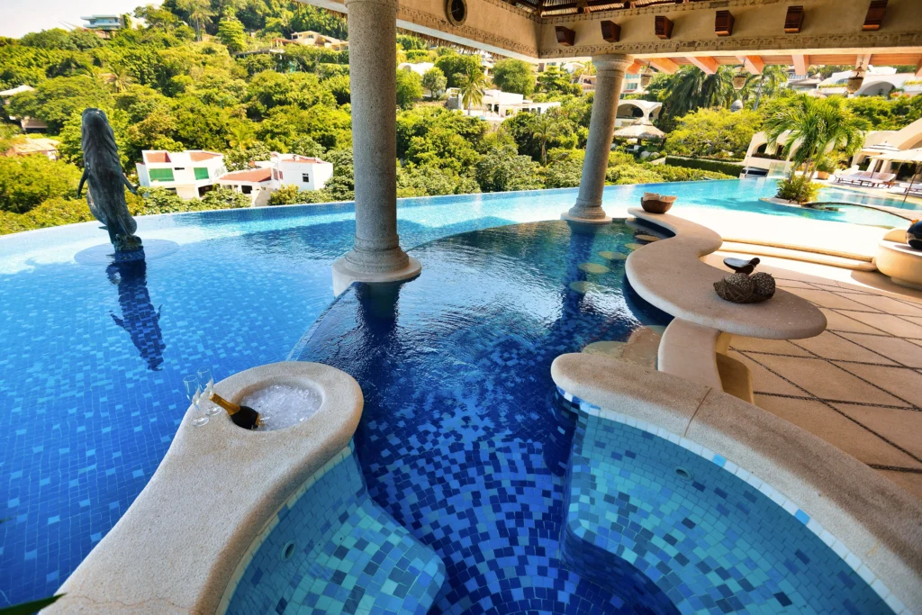 Infinity pool and terrace above Acapulco Bay at Villa Sabalo