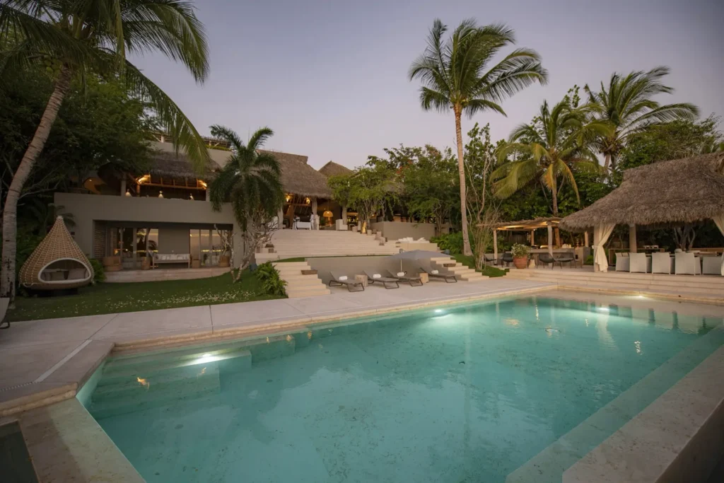 Casarena the pool and thatched pavilions among the palms — Punta Mita, Mexico