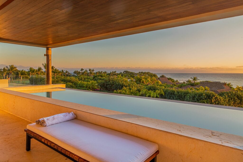 Condo Haramara a rolled towel on the bench beside the terrace pool at sunset — Punta Mita, Mexico