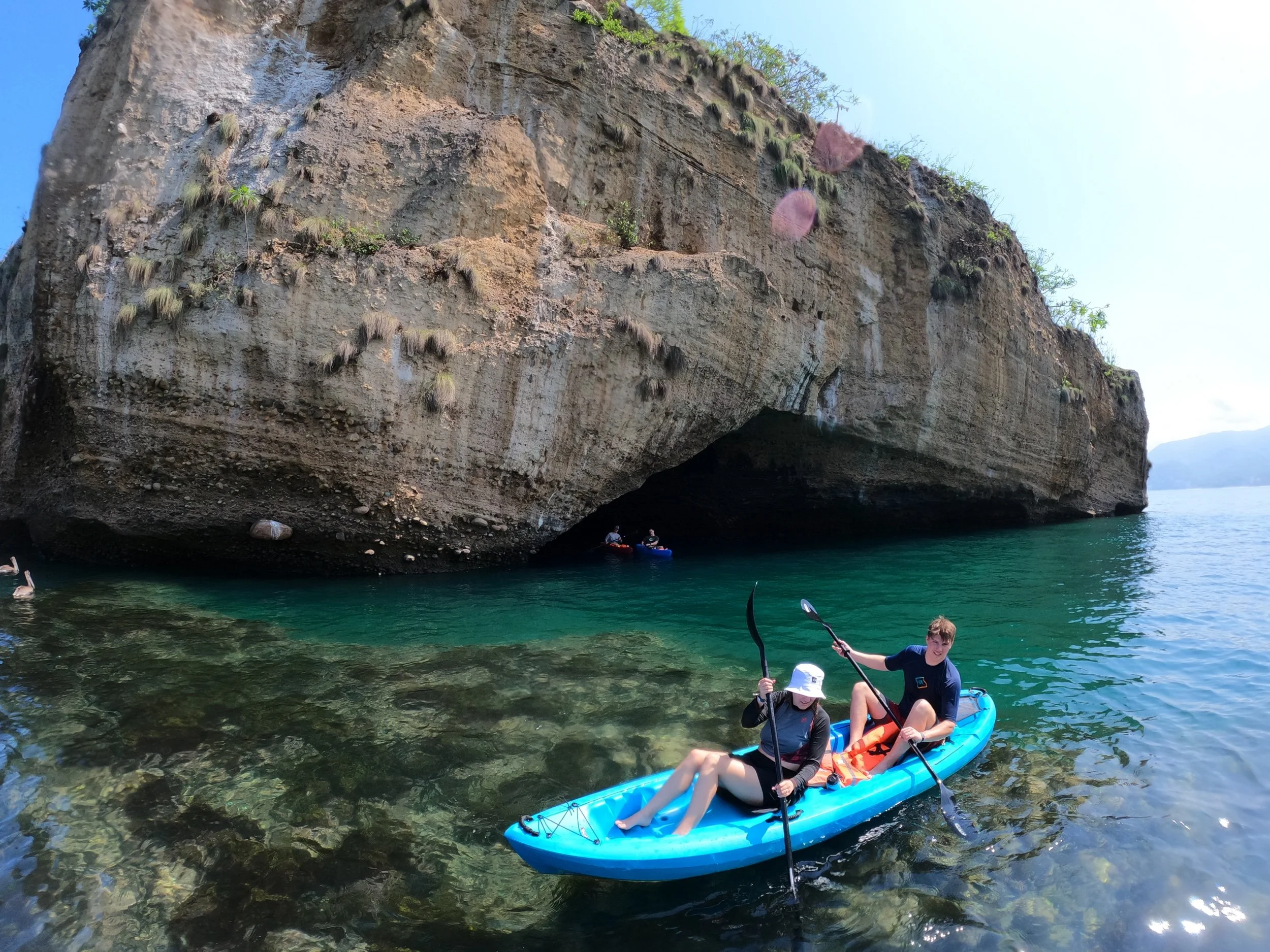 Kayaking through crystal-clear waters at Los Arcos marine park, Puerto Vallarta