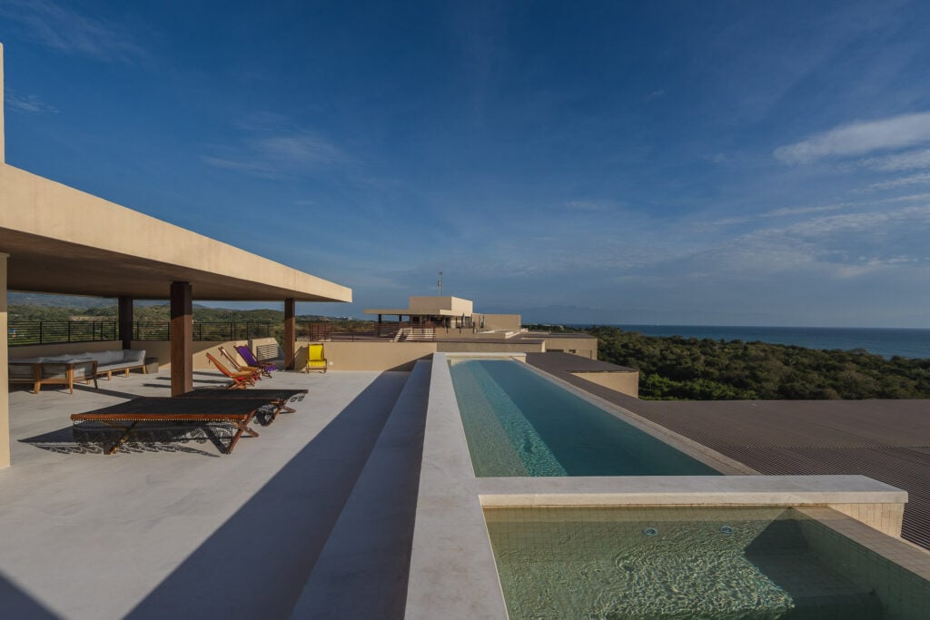 Penthouse ArenaMar the rooftop pool and loungers along the terrace by day — Punta Mita, Mexico