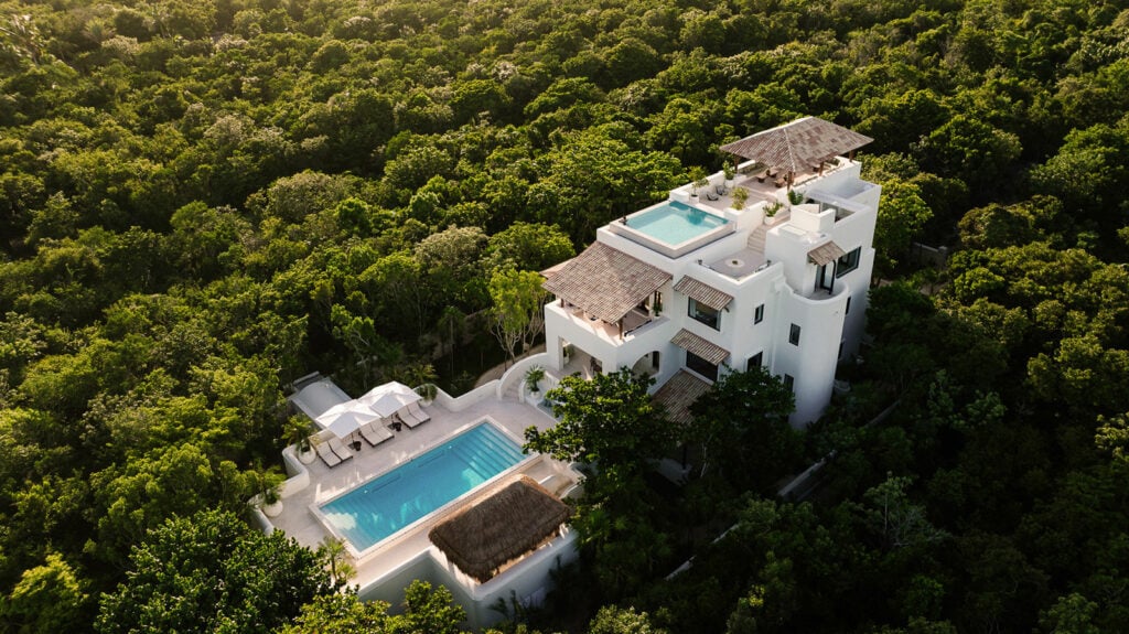 Esencia La Mansion the house and its two pools seen from the air over the jungle — Tulum, Mexico