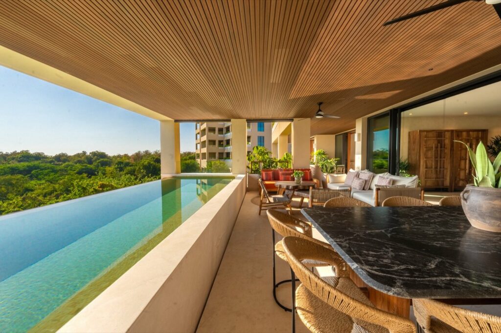 Surf Residences 211 pool beside a covered terrace dining table — Punta Mita Nayarit, Mexico