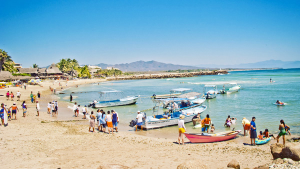 Fishing pangas and charter boats at El Anclote pier Punta Mita