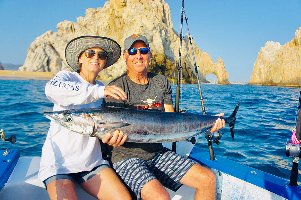 Sport fishing charter boat departing Cabo San Lucas marina for deep sea fishing in the Pacific