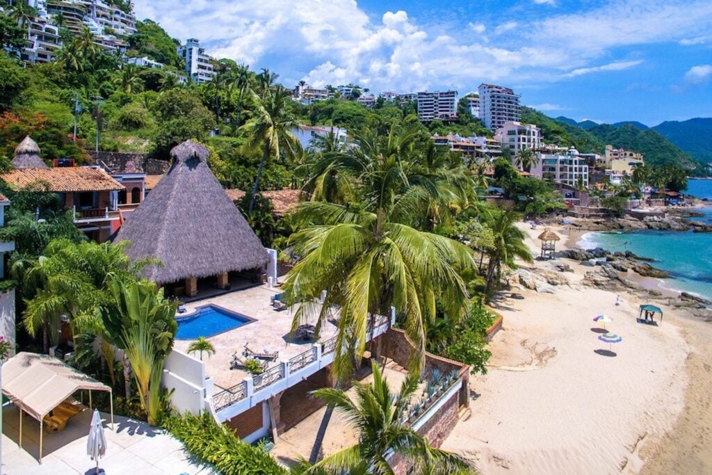 Villa Verde pool terrace and thatched roof beside the beach — Puerto Vallarta, Mexico