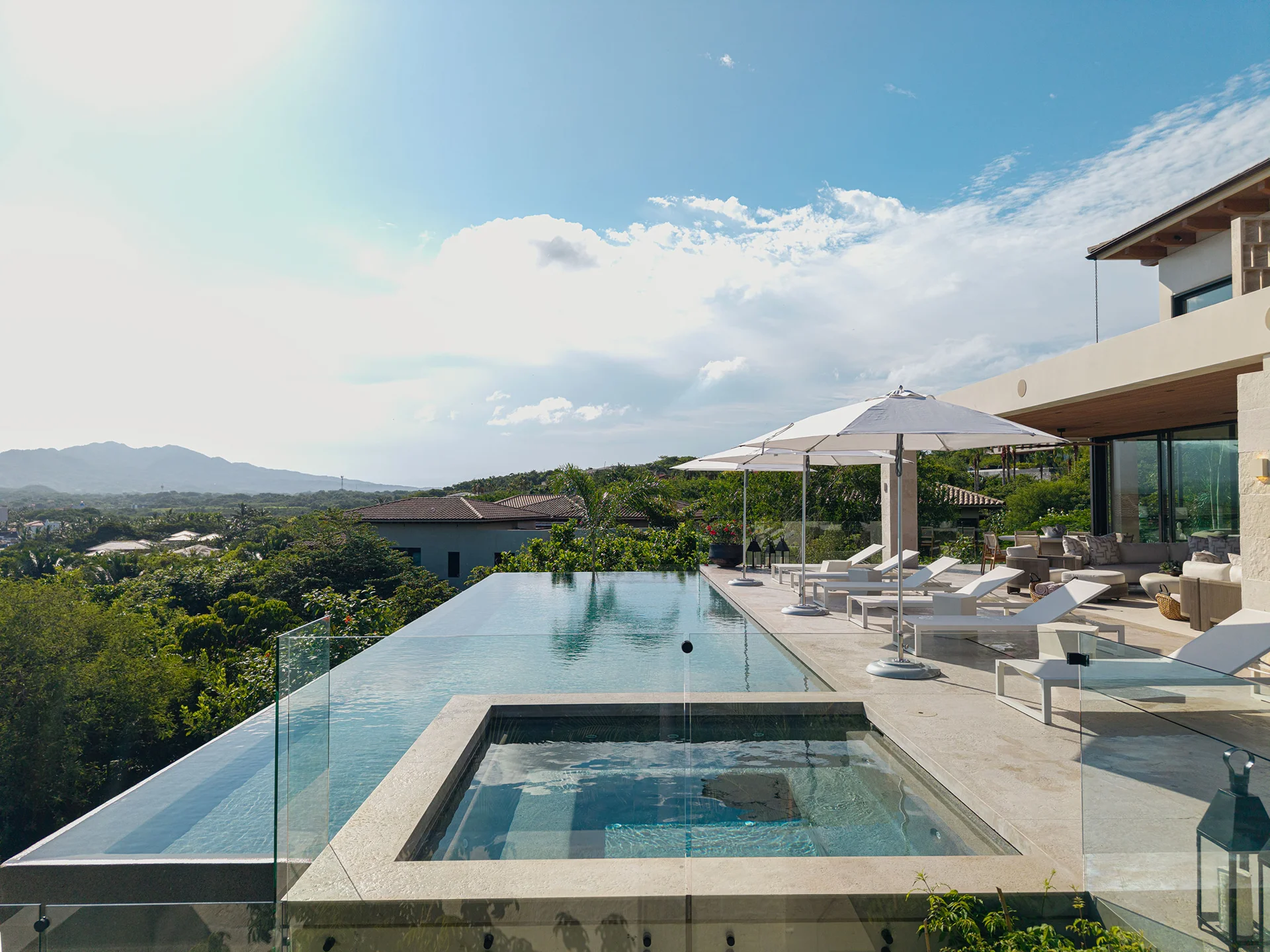 Glass-edged infinity pool and sun terrace at Casa Mare looking out over Banderas Bay from Kupuri Estates, Punta Mita