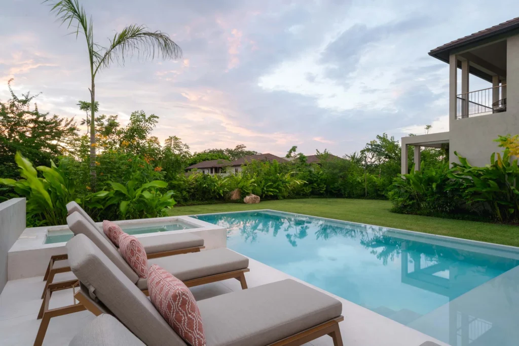 Villa Ceiba sun lounger on the lawn beside the pool — Selva Residences, Punta Mita