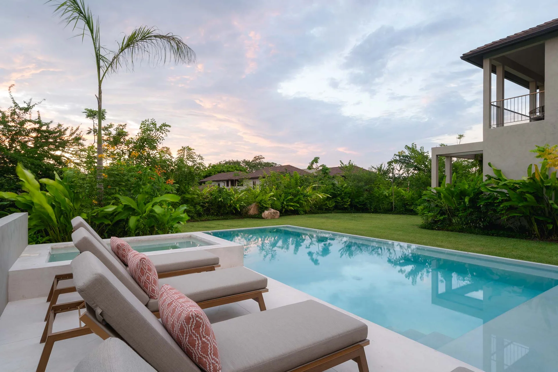 Villa Ceiba sun lounger on the lawn beside the pool — Selva Residences, Punta Mita